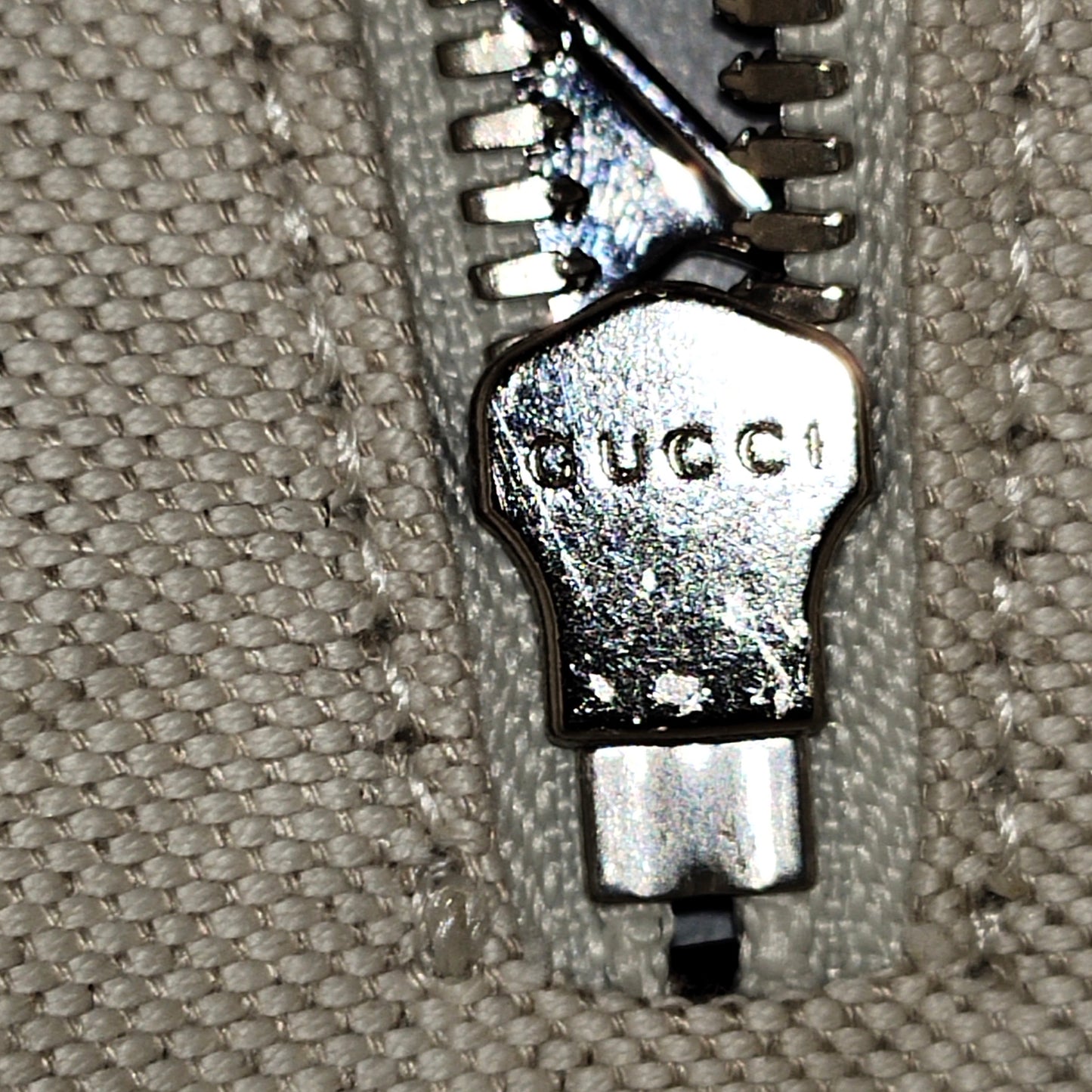 GG Embossed Perforated Square Bag